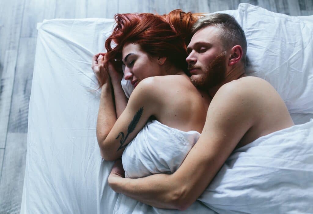 Young couple in bed together